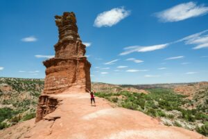 Kate Storm standing in front of the Lighthouse in Palo Duro Canyon TX