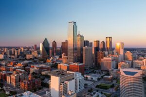 Dallas skyline as seen from Reunion Tower at sunset. Dallas is one of the most romantic getaways in Texas for couples