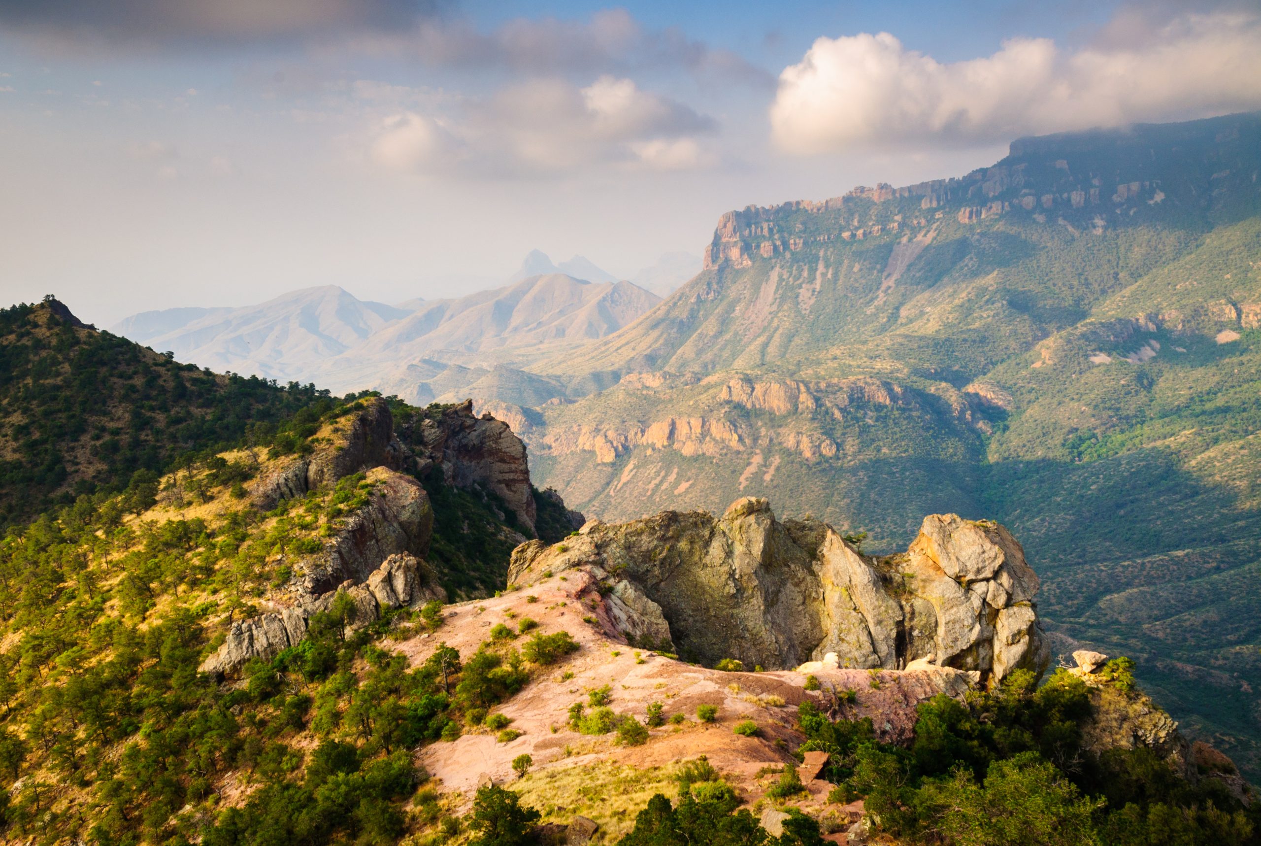 View of Big Bend National Park from above with dramatic hills and rocky landscape, one of the best road trips from Austin