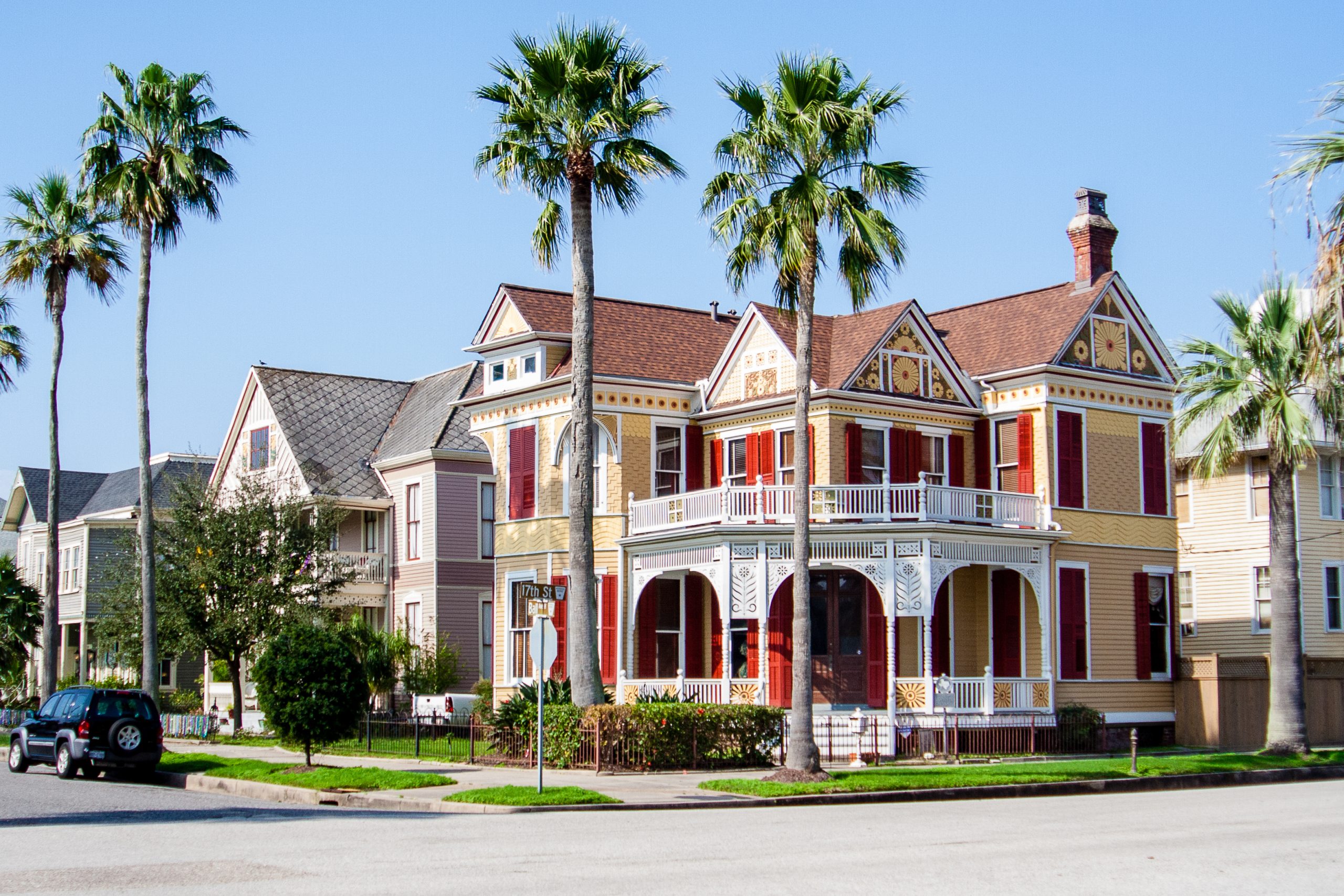 Yellow house situated on a corner in the East End Historic District. Strolling by these Victorian homes is one of the best things to do in Galveston TX
