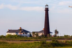 black point bolivar lighthouse with keepers cottages, one of the best texas lighthouses to visit