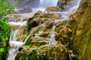 close up of gorman falls in colorado bend, one of the best texas state parks near austin tx