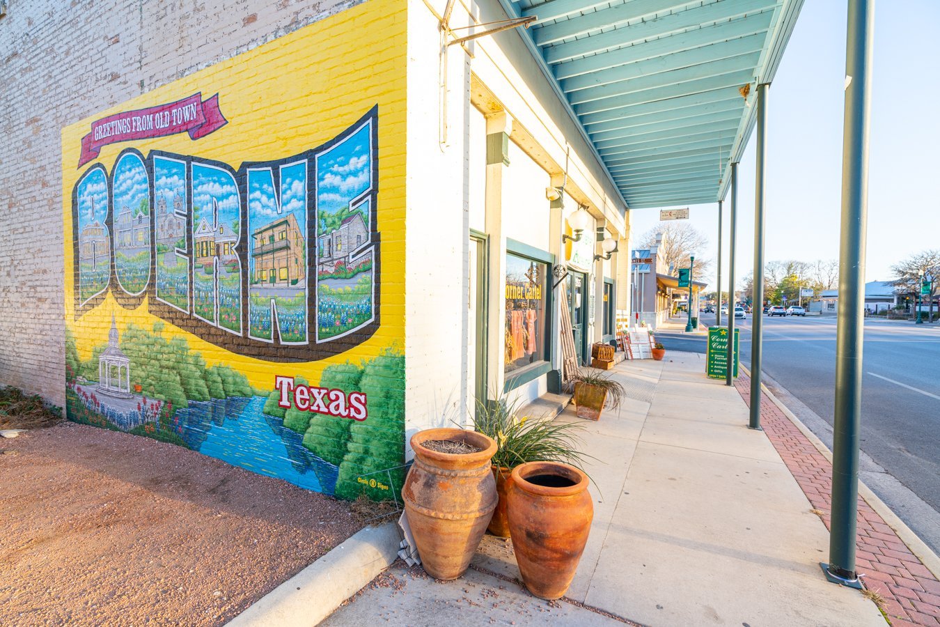 mural in boerne texas, painted on the side of a brick building. exploring downtown is one of the best things to do in boerne tx