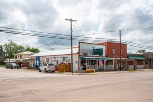 shops in downtown centerville texas with a mural visible on one side