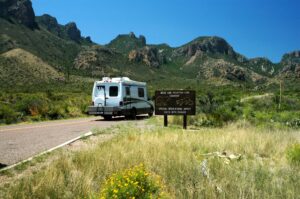 small white rv in big bend np driving to one of the best rv parks near big bend national park